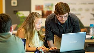 Two students working at a computer